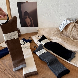 Cozy wool blend calf socks in various colors with striped cuffs for autumn and winter