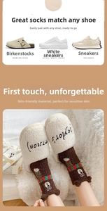 Detail of coral fleece bear socks with 3D ears and embroidered bowtie for winter warmth
