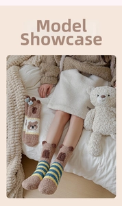 Close-up of cozy Capybara coral fleece socks with cute cartoon bear ears and stripe details