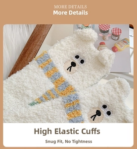 Close-up of fluffy polar bear embroidery and elastic cuff on white coral fleece socks