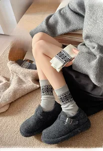 Close-up of vintage Fair Isle knit socks with thick warm texture and geometric patterns