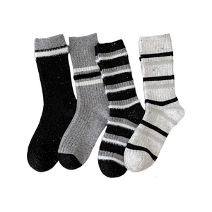Thick wool blend striped crew socks for women featuring ribbed texture and warm knit patterns