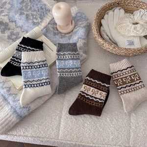 Five pairs of retro wool socks with bow patterns in warm winter knit colors