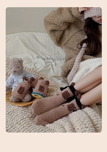 Detail of warm Capybara coral fleece socks featuring cute 3D ears and plush texture