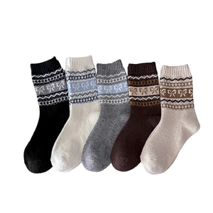Five pairs of vintage Fair Isle wool socks with bow patterns in autumn earth tones