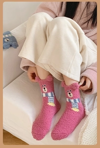 Detailed view of pink coral fleece socks with 3D bear ears and cute bear embroidery