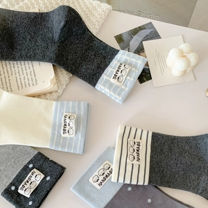 Cozy cotton crew socks featuring cute cartoon puppy labels in assorted neutral colors