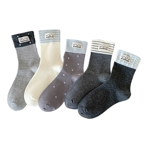 Five pairs of cute cartoon puppy mid-calf socks in various colors and patterns