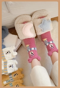 Close-up of pink coral fleece socks with 3D bear ears and cute embroidery for winter