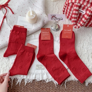 Set of four vintage dark red mid-calf knit socks with embossed heart and luck patterns