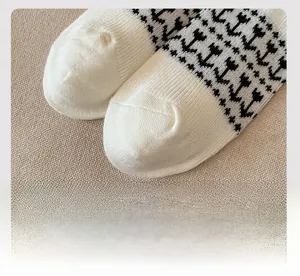 Detailed macro view of flat-sewn toe seam on vintage Fair Isle knit wool socks