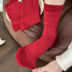 Retro dark red cotton socks with relief LUCK lettering and heart patterns in a mid-calf style