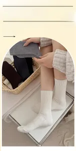 Detailed knit texture of thick cashmere-like socks in neutral autumn color palette