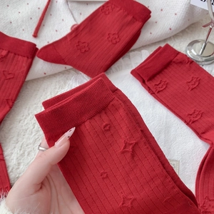 Vintage dark red crew socks featuring 3D embossed floral patterns and ribbed cuffs