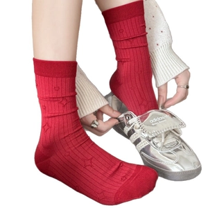 Retro dark red mid-calf socks with textured star patterns and ribbed knit finish