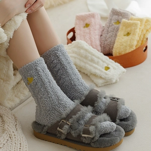 Thick coral fleece socks for women featuring heart embroidery and soft plush texture