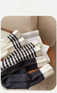 Close-up of striped cotton socks showing breathable ribbed texture and premium knit detail
