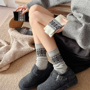 Thick Nordic Fair Isle knit crew socks for women featuring cozy geometric pattern