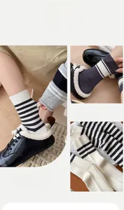 Detailed view of striped cotton knit crew socks with vertical texture and classic colors