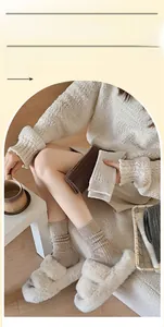 Detail of speckled yarn texture and cable knit patterns on these warm winter socks