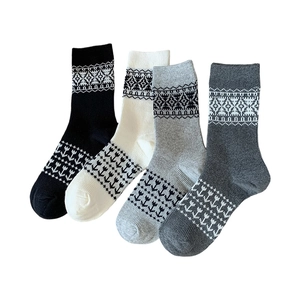 Cozy Fair Isle knit crew socks for women featuring Nordic geometric patterns in four colors