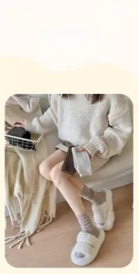 Detail showing thick vertical cable knit texture and soft warm material of mid-calf socks