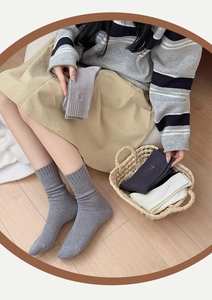 Close-up of knit texture and embroidery on striped cotton crew socks for women