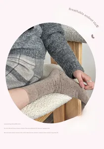 Detail of light brown Japanese style crew socks with black polka dot patterns