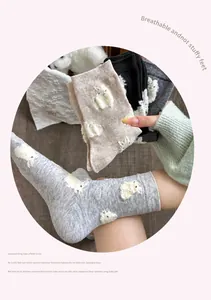 Close-up of breathable cotton crew socks with cute white animal embroidery detail