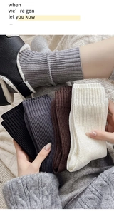Thick ribbed knit crew socks in neutral colors with reinforced cuffs for autumn and winter