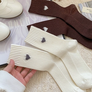 Cozy ribbed crew socks with heart embroidery in cream and dark coffee colors