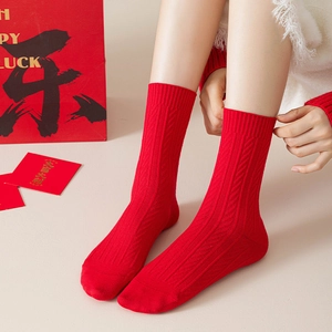 Festive red knit crew socks with thick cable texture for Chinese New Year styling