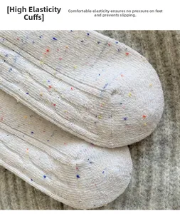 Close-up of high-elasticity cuff and knit texture on colorful speckled winter wool socks