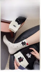Detail of high-elasticity cuffs on cartoon cat crew socks for a comfortable fit