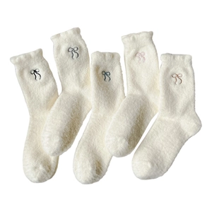 Five pairs of fluffy white thermal socks with cute embroidered bows and wavy cuffs