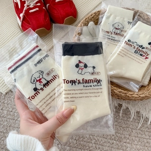 Japanese style white crew socks with cartoon puppy embroidery and bow details