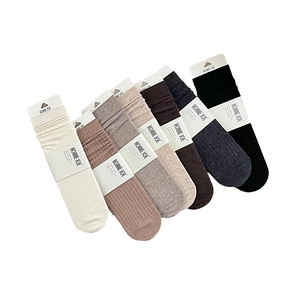 Solid color wool crew socks for women in assorted earth tones with rib-knit texture