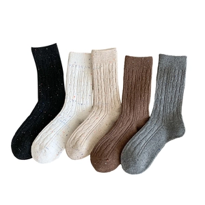 Thick ribbed knit wool crew socks in five vintage colors with colorful speckled dots