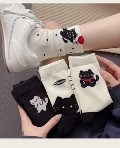 Detail of cute cat jacquard pattern and miao text on knitted cotton mid-calf socks