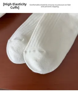 Detail of white ribbed cotton socks featuring high elasticity cuff for comfort