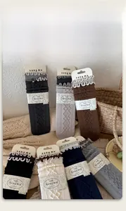 Detailed view of silk wool socks with 3D diamond pattern and ruffled edge design