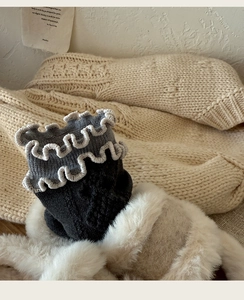 Detail of wool silk socks with diamond pattern, frilly edges and thermal knit texture