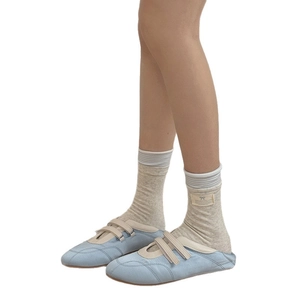 Blue-grey striped mid-calf socks with bow label and blue Mary Jane canvas shoes