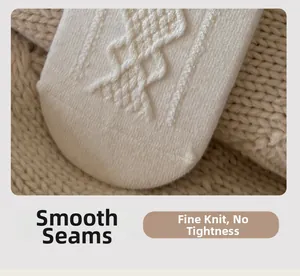 Detailed close-up of smooth seamless toe stitching on white silk wool knit socks