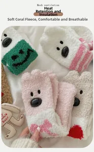 Detail of coral fleece winter socks with cute cartoon bear faces and mesh ventilation