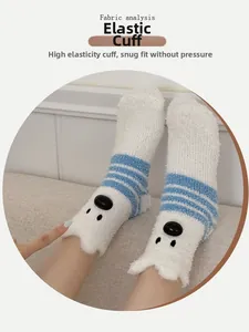 Detail of white coral fleece socks with blue stripes and polar bear embroidery