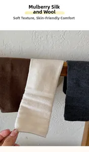 Close-up of three pairs of mulberry silk wool waffle knit socks in brown, beige, and grey