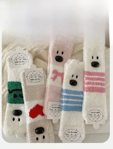 Detailed set of five thick coral fleece socks with cute 3D cartoon dog nose designs