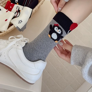 Cute cartoon penguin crew socks in grey with black trim and soft cotton texture