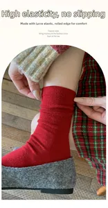 Detail of red wool socks featuring Lycra elastic band and rolled edge for non-slip comfort
